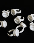 White plastic rings on a dark background