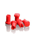 Red plastic components on a white background